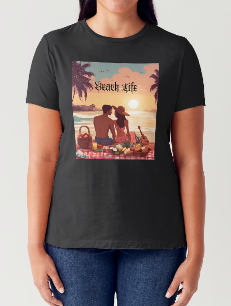 "Embrace adventure in our "Beach Life" cotton tee! This Women's T-shirt is featuring a relaxed fit that transports you to a tropical paradise with its picnic scene of a couple enjoying the sunset over the ocean. Bring the beach life with you wherever you go!" Available in Blue or Black colors. This is part of the Mike Roxly Collection.