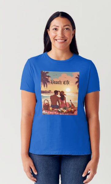 "Embrace adventure in our "Beach Life" cotton tee! This Women's T-shirt is featuring a relaxed fit that transports you to a tropical paradise with its picnic scene of a couple enjoying the sunset over the ocean. Bring the beach life with you wherever you go!" Available in Blue or Black colors. This is part of the Mike Roxly Collection.
