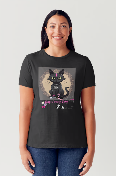 "The 'Keep Stepping Bitch' t-shirt packs a punch with its sassy black cat and bold pink lightning bolt design. Complete with punk/gothic boots, lucky dice, and sexy red cherries, this shirt exudes confidence and attitude. Perfect for those who are unapologetically themselves. Get ready to step up your style game." Available in Black color t-shirt and sizes small through XX-Large. This is part of the Mike Roxly Collection.