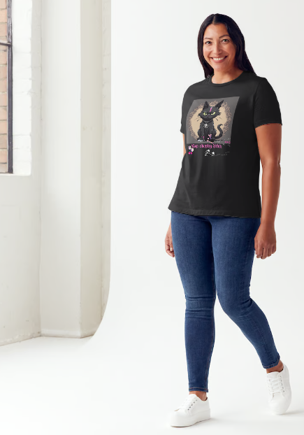 "The 'Keep Stepping Bitch' t-shirt packs a punch with its sassy black cat and bold pink lightning bolt design. Complete with punk/gothic boots, lucky dice, and sexy red cherries, this shirt exudes confidence and attitude. Perfect for those who are unapologetically themselves. Get ready to step up your style game." Available in Black color t-shirt and sizes small through XX-Large. This is part of the Mike Roxly Collection.
