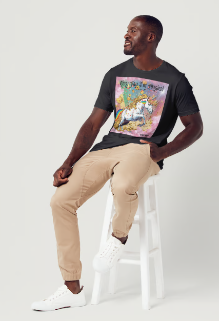 This is a black t-shirt entitled "they say I'm magical", features a White unicorn with a blinding light from its' horn, a golden mane and a rainbow tail galloping through cotton candy pink clouds filled with raining golden coins and a multicolor background. This shirt is for the bold unapologetically yourself type of guy. YOLO. This is part of the Mike Roxly Collection.