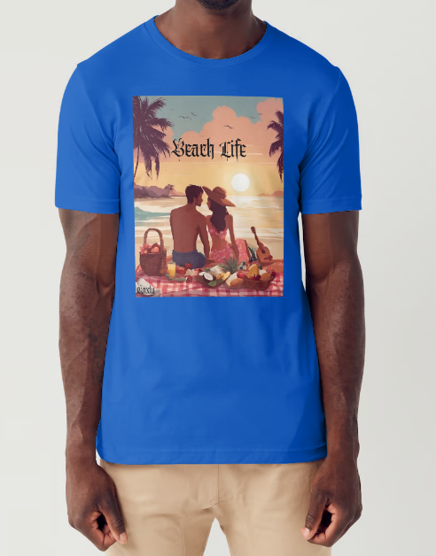 This is a model wearing a t-shirt entitled "Beach Life" men's graphic t-shirt. The shirt itself is blue in color. Made of soft and breathable cotton, this shirt embodies the perfect beach day with a romantic scene full of warm colors, it features a couple enjoying a sunset picnic surrounded by palm trees by the ocean. Let the bold design and adventurous spirit inspire your next adventure!" This is a Mike Roxly collection T-shirt