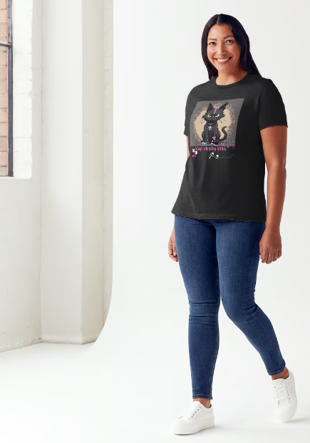 "The 'Keep Stepping Bitch' t-shirt packs a punch with its sassy black cat and bold pink lightning bolt design. Complete with punk/gothic boots, lucky dice, and sexy red cherries, this shirt exudes confidence and attitude. Perfect for those who are unapologetically themselves. Get ready to step up your style game." Available in Black color t-shirt and sizes small through XX-Large.  This is part of the Mike Roxly Collection.