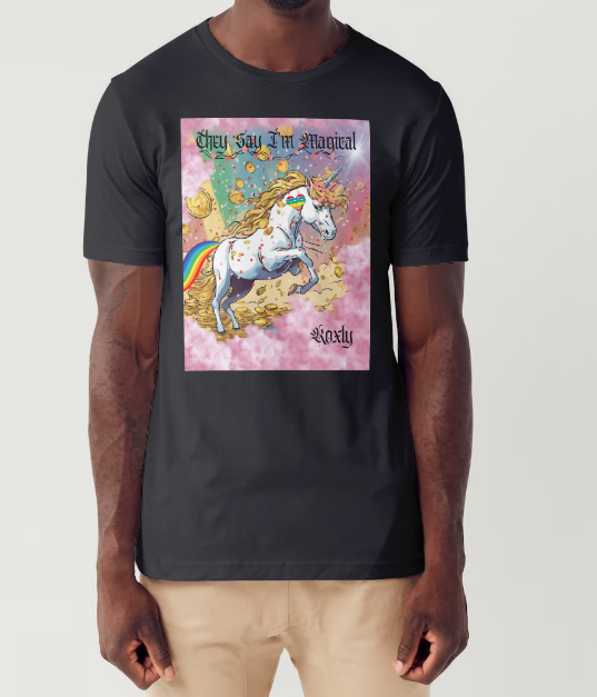 This is a black t-shirt entitled "they say I'm magical", features a White unicorn with a blinding light from its' horn, a golden mane and a rainbow tail galloping through cotton candy pink clouds filled with raining golden coins and a multicolor background.  This shirt is for the bold unapologetically yourself type of guy. YOLO.  This is part of the Mike Roxly Collection.