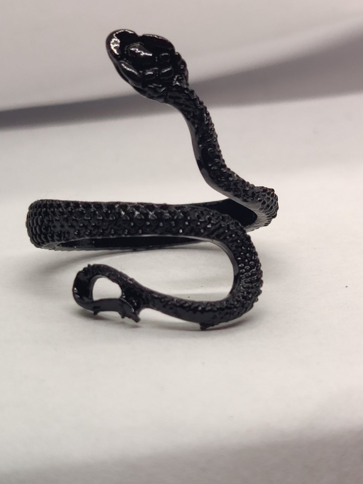 Black shedding snake ring